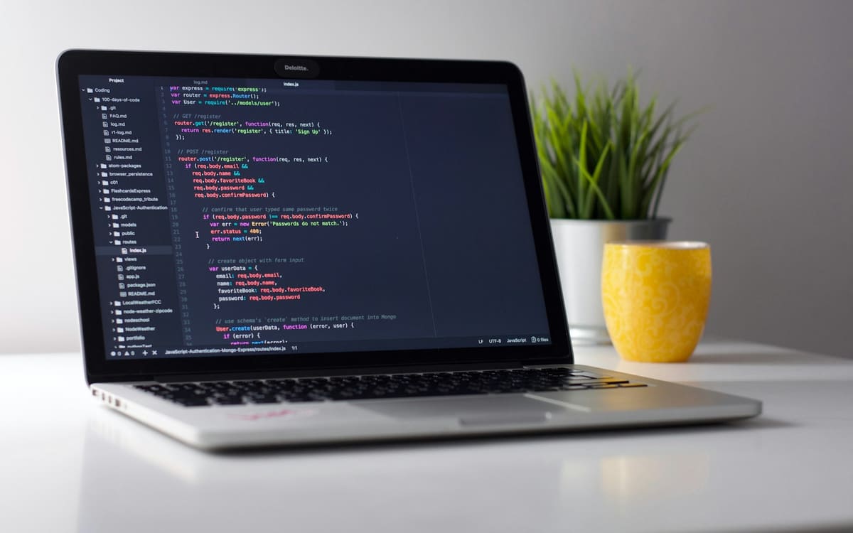 Laptop with application code on screen